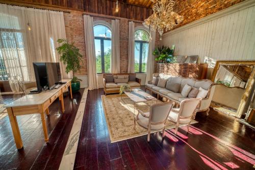 a living room with a couch and a table at Factoria Hotel in Asuncion