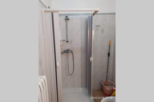 a shower with a glass door in a bathroom at La tavernetta di Bruno in Gallipoli