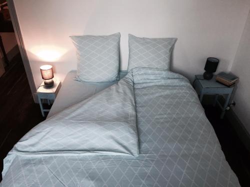 En eller flere senge i et værelse på GrIsa'Home le gîte