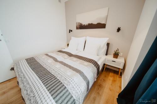 Postel nebo postele na pokoji v ubytování Marta Grottgera Apartments