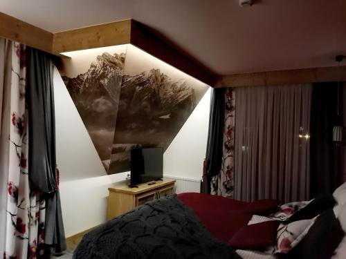 Postel nebo postele na pokoji v ubytování KRYWAŃ RESIDENCE - stylowe apartamenty najwyższe opinie gości