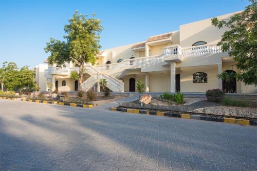 an empty street in front of a building at Barracuda Resort in Umm Al Quwain