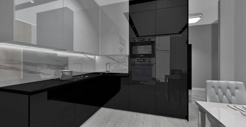 cocina en blanco y negro con fogones en Apartament Tempo per Te, en Zakopane