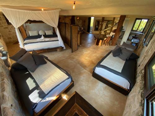 an aerial view of a bedroom with two beds at Sueños Tulum in Tulum