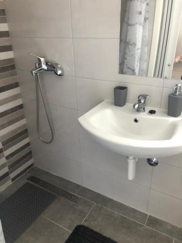 a bathroom with a sink and a shower at Little house Ljubica in Kampor
