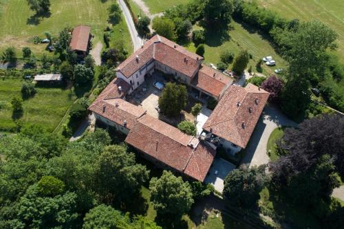 an aerial view of an old house in a field at Dandelion Como Suites & Park in Villa Guardia
