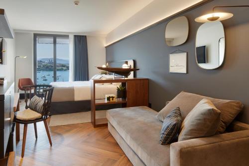 a living room with a couch and a table at Hotel SANSEbay in San Sebastián