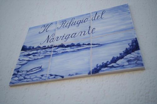 a sign on a wall with a painting on it at Il Rifugio del Navigante in Otranto
