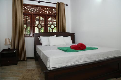 Una cama o camas en una habitación de Nima villa