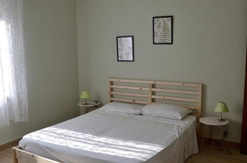 Villa Minù tesisinde bir odada yatak veya yataklar