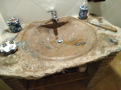 a wooden sink in a bathroom with at Casa Maldonado in Yátor