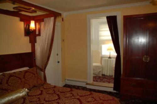 a bedroom with a bed and a large window at Artful Lodger in Newport