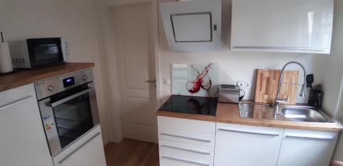 Kuchyň nebo kuchyňský kout v ubytování Deichresidenz Büsum