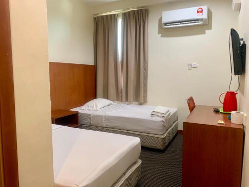 Postel nebo postele na pokoji v ubytování Grand Hotel 2