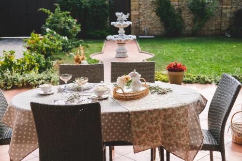 a table with a white tablecloth and chairs with a table at Bonita in Zatoka