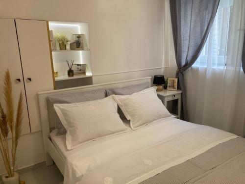 Ένα ή περισσότερα κρεβάτια σε δωμάτιο στο Old pearl apartment