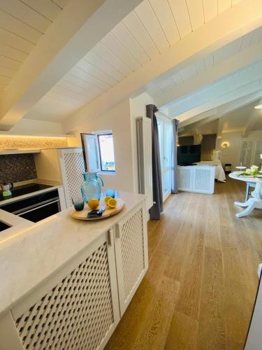 a kitchen with a counter with a bowl of oranges on it at Deodato Apartments in Tropea