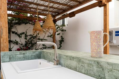 a kitchen with a sink and a counter top at Casa Aguila Ibiza in Cala Vadella