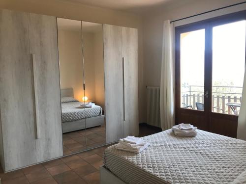 Giường trong phòng chung tại Residenza Margherita