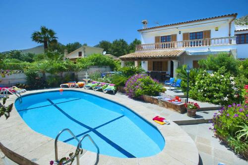 a large swimming pool in front of a house at Villa Carla by Sealand Villas in Port de Pollensa