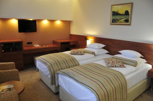 Cama ou camas em um quarto em Hotel Central