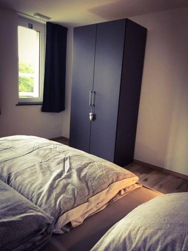 Ένα ή περισσότερα κρεβάτια σε δωμάτιο στο Vakantiewoning d'Hoppe