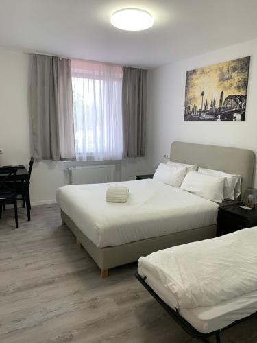 Katil atau katil-katil dalam bilik di Apartments am Rheingarten