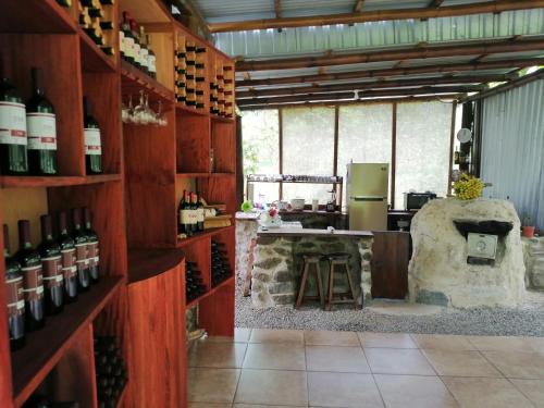 a room with a counter with bottles of wine at EYA Ecolodge in San Isidro