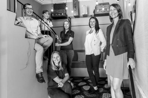 a group of people standing in a room at La Valiz in Lille