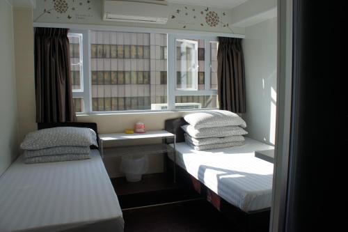 Postel nebo postele na pokoji v ubytování Ocean Inn