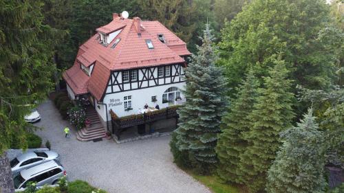 an aerial view of a large house with a red roof at Mon Plaisir in Karpacz