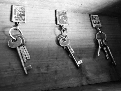 a bunch of keys hanging on a wall at Antica Locanda La Tinara del Belvedere - Romantic Dreams - in Galbiate
