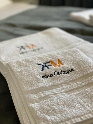 a napkin with the name of a restaurant on it at apartament LeśnaCedzyna in Cedzyna
