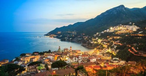a view of a town on a hill next to the water at Casa vacanze Amalfitan Coast in Vietri sul Mare