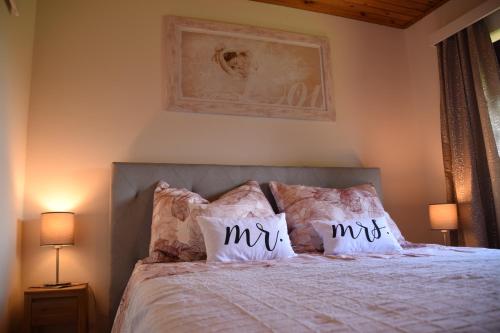 a bedroom with a bed with two pillows on it at Ferienhaus Jagafranzl in Gnas