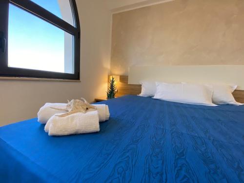 
A bed or beds in a room at La Rustica Hotel
