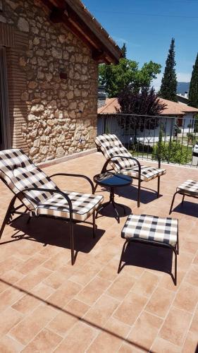 a group of chairs and a table on a patio at La Casetta di nonnaNà - Casa vacanze in Terni