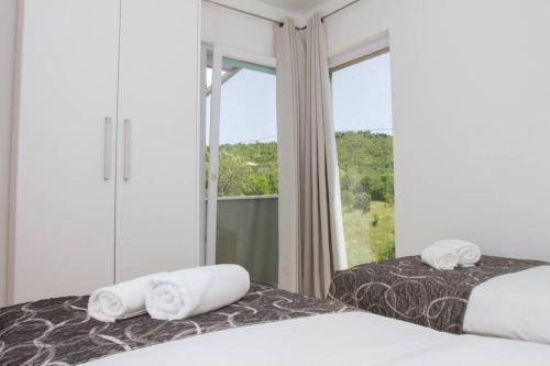 Postel nebo postele na pokoji v ubytování Holiday house Villa Bleu