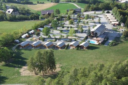 an aerial view of a group of houses in a field at Chalet calme in Saint-Léger-les-Mélèzes