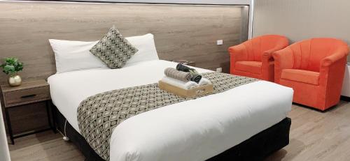 Un ou plusieurs lits dans un hébergement de l'établissement Elm Motel