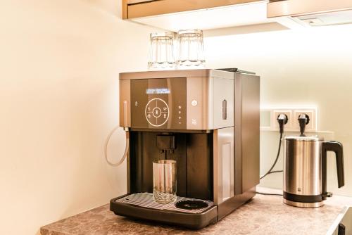 Kuchyň nebo kuchyňský kout v ubytování FirstClass Apartments