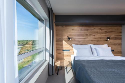 Postel nebo postele na pokoji v ubytování Boutique Hotel Vinařství Škrobák