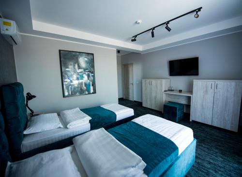 Postel nebo postele na pokoji v ubytování ZEN Hotel Focșani