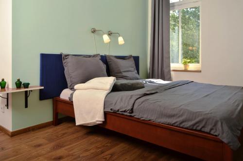 En eller flere senge i et værelse på Apartmány Irisis