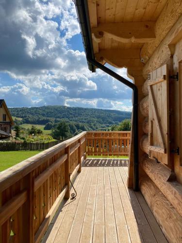 a view from the deck of a cabin with a view at Jurkowa Wola in Jureczkowa