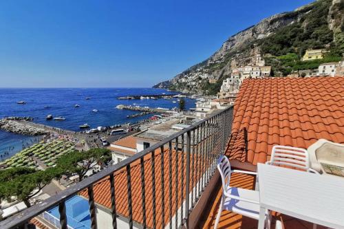 a view of the ocean from a balcony at Mamma Rosanna - Apartment in Amalfi with terrace in Amalfi
