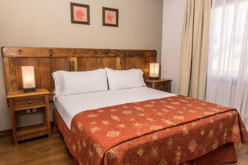 Postel nebo postele na pokoji v ubytování Rincón del Calafate