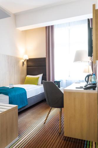 Ένα ή περισσότερα κρεβάτια σε δωμάτιο στο Stay inn Hotel Gdańsk