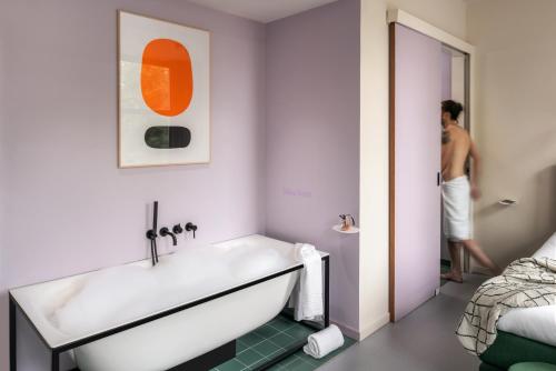 Llit o llits en una habitació de Hotel Unplugged