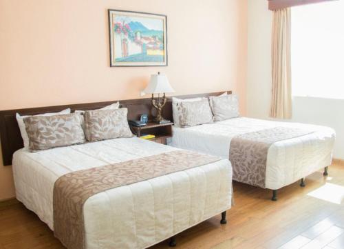 Cama o camas de una habitación en Hotel Pensión Bonifaz
